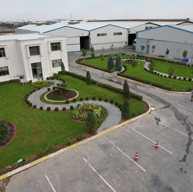 Landscaped grounds with lawns, hedges and planting beds at the Fabyab project